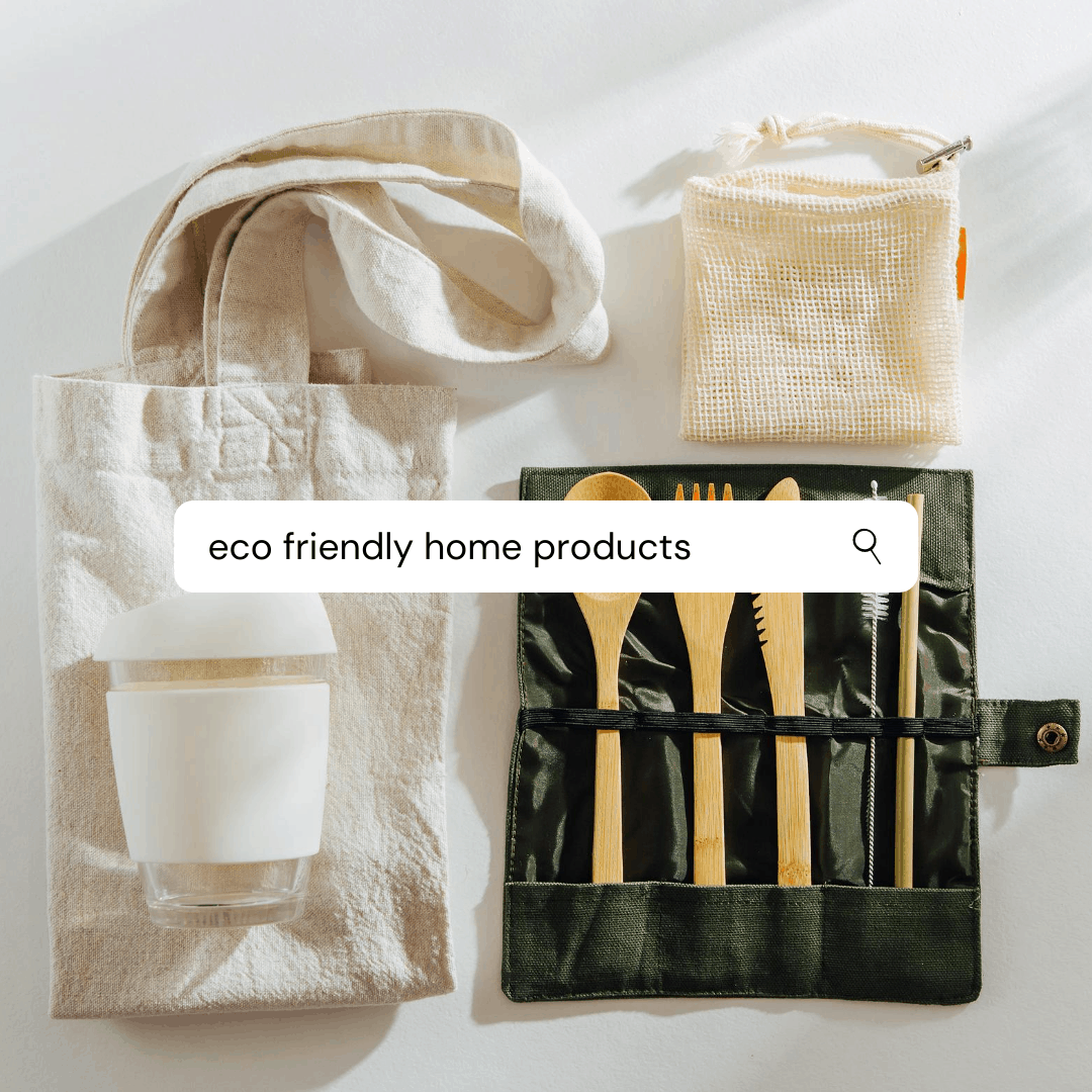 a search bar over an image. the search bar reads "eco friendly home products" the image is of a folded re-usable bag, a bamboo set of cutlery in a nice carry case and a reusable mesh bag 
